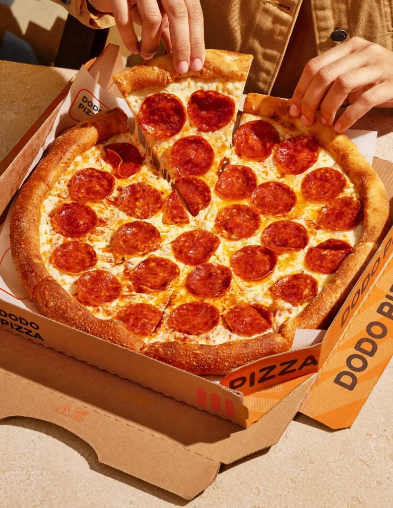 Pizza on picnic table